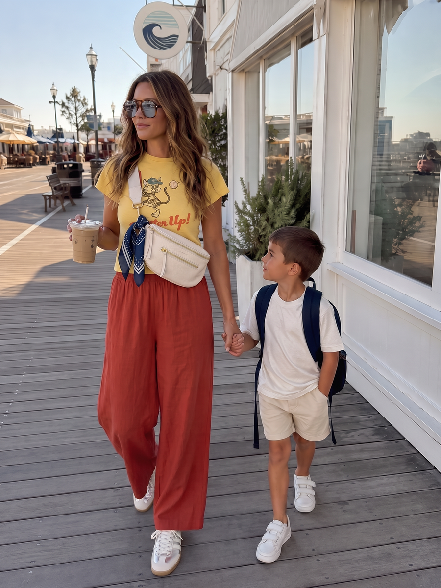 Main Character Morning outfit from Shop Common Thread, the Scout linen pant with a paisley scarf, crossbody bag and metallic sneakers